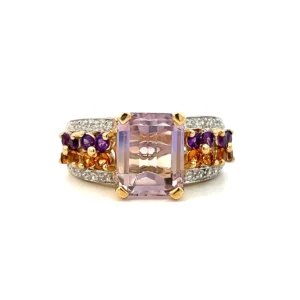 One Estate Citrine, White Sapphire, and Amethyst Ring crafted from gold-plated sterling silver and featuring a center emerald-cut light purple amethyst in a four-prong setting. The band features 4 rows with the outer two rows being round white sapphires, one inner row being round dark purple amethyst, and the other inner row being round citrines.