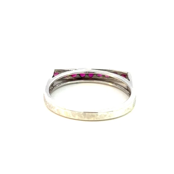 One Estate Ruby Bar Ring crafted from sterling silver featuring a vertical bar design pave-set with 9 round rubies measuring 1.70mm each.