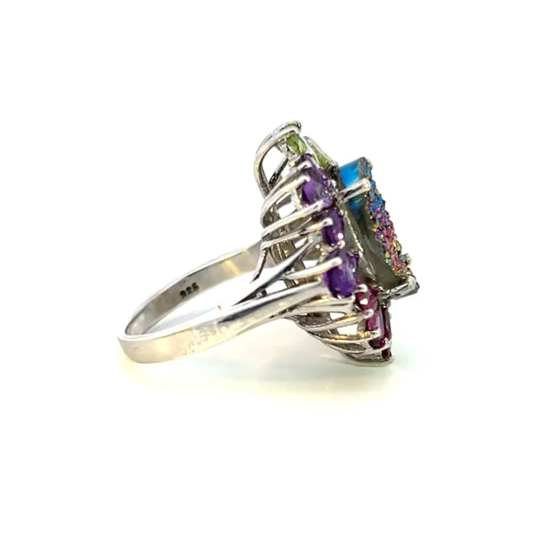 Estate sterling silver ring with a dyed quartz geode in peacock blue and purplish magenta, accented by pear-shaped garnet, citrine, amber, and peridot gemstones.