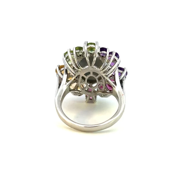 Estate sterling silver ring with a dyed quartz geode in peacock blue and purplish magenta, accented by pear-shaped garnet, citrine, amber, and peridot gemstones.