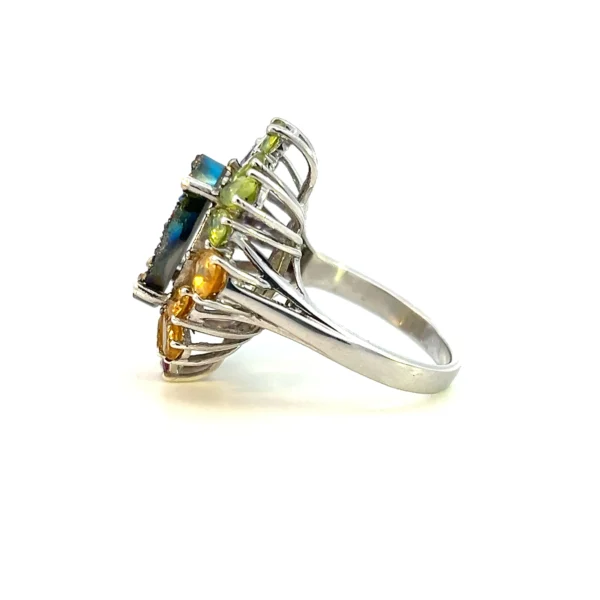 Estate sterling silver ring with a dyed quartz geode in peacock blue and purplish magenta, accented by pear-shaped garnet, citrine, amber, and peridot gemstones.