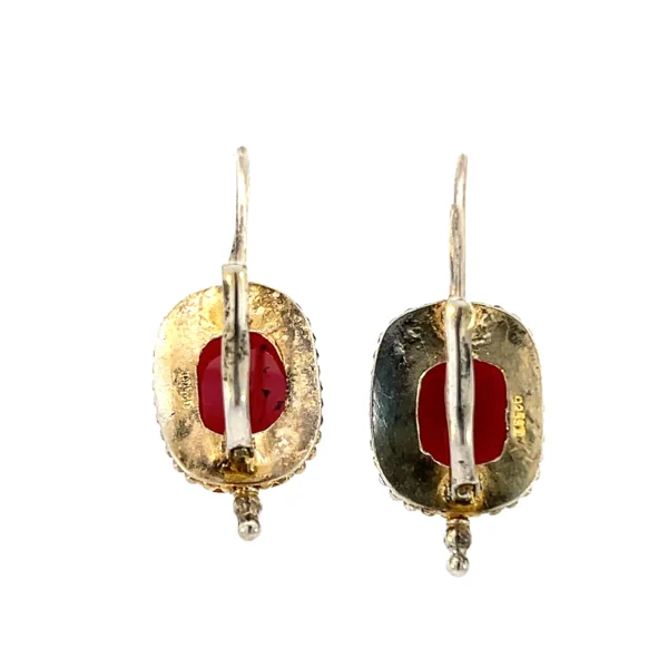 One pair of estate vermeil oval cabochon garnet drop earrings. Each garnet is in a bezel setting with vintage-inspired texture.