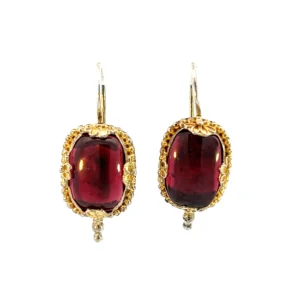 One pair of estate vermeil oval cabochon garnet drop earrings. Each garnet is in a bezel setting with vintage-inspired texture.