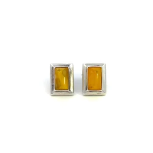 One estate pair of sterling silver rectangle-shaped stud earrings each bezel-set with a rectangle-shaped cabochon Baltic amber.