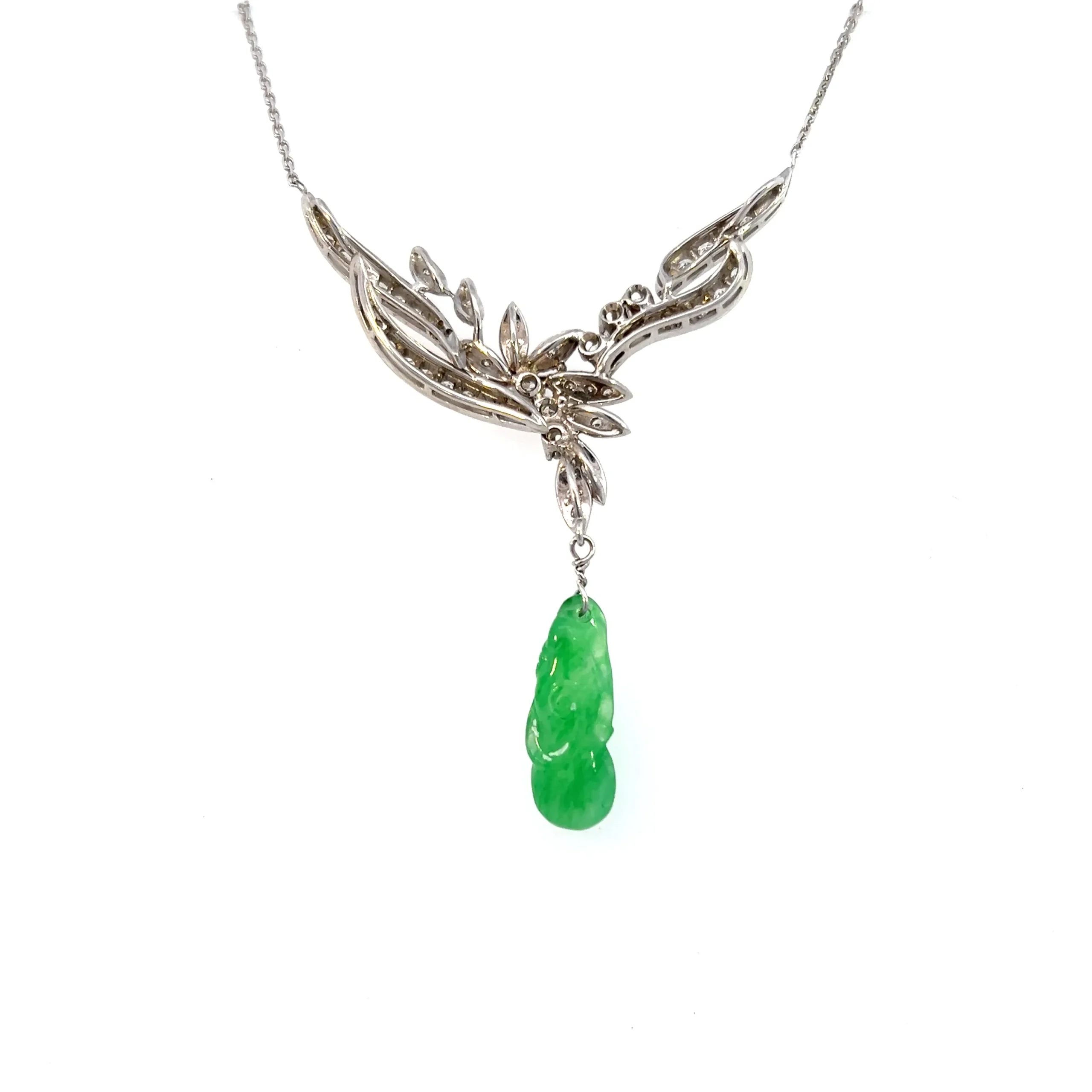 Estate Vintage 14K White Gold Necklace with a carved green jadeite dangle and round diamond accents in a nature-inspired design.