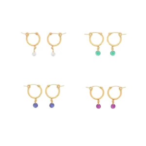 A selection of four of the different styles of gold-filled small chunky hoop earrings with gemstone drops from designer Dee Berkley