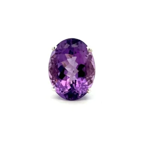 One estate sterling silver solitaire ring containing one oval-shaped faceted amethyst weighing 0.38 carat in a four-prong setting.