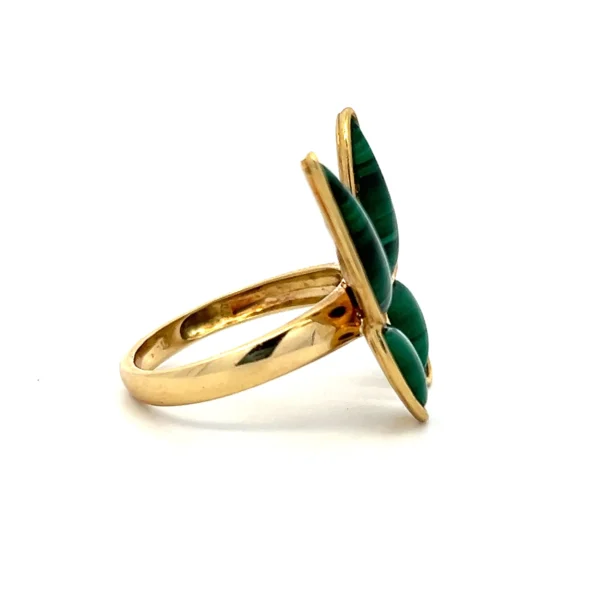 One estate 8 karat yellow gold butterfly ring set with 4 custom cut pieces of malachite in the 4 sections of the butterfly's wings. From the 1980s.