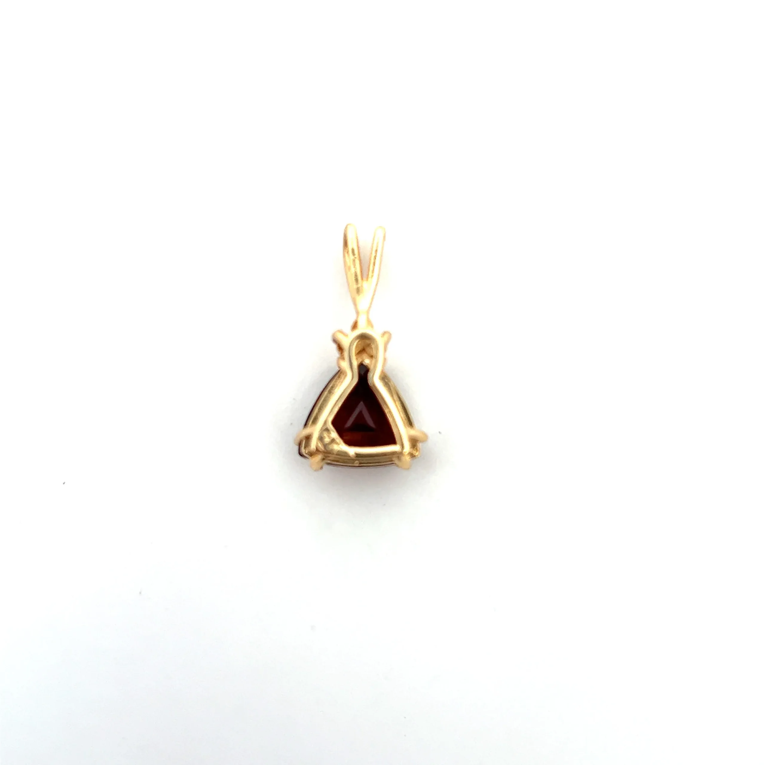 One estate 14 karat yellow gold pendant with a trillion-cut garnet weighing 2.49 carats and 3 round brilliant diamonds weighing 0.05 carat total weight clustered at the top of the garnet. the pendant has a rabbit-ear bail.