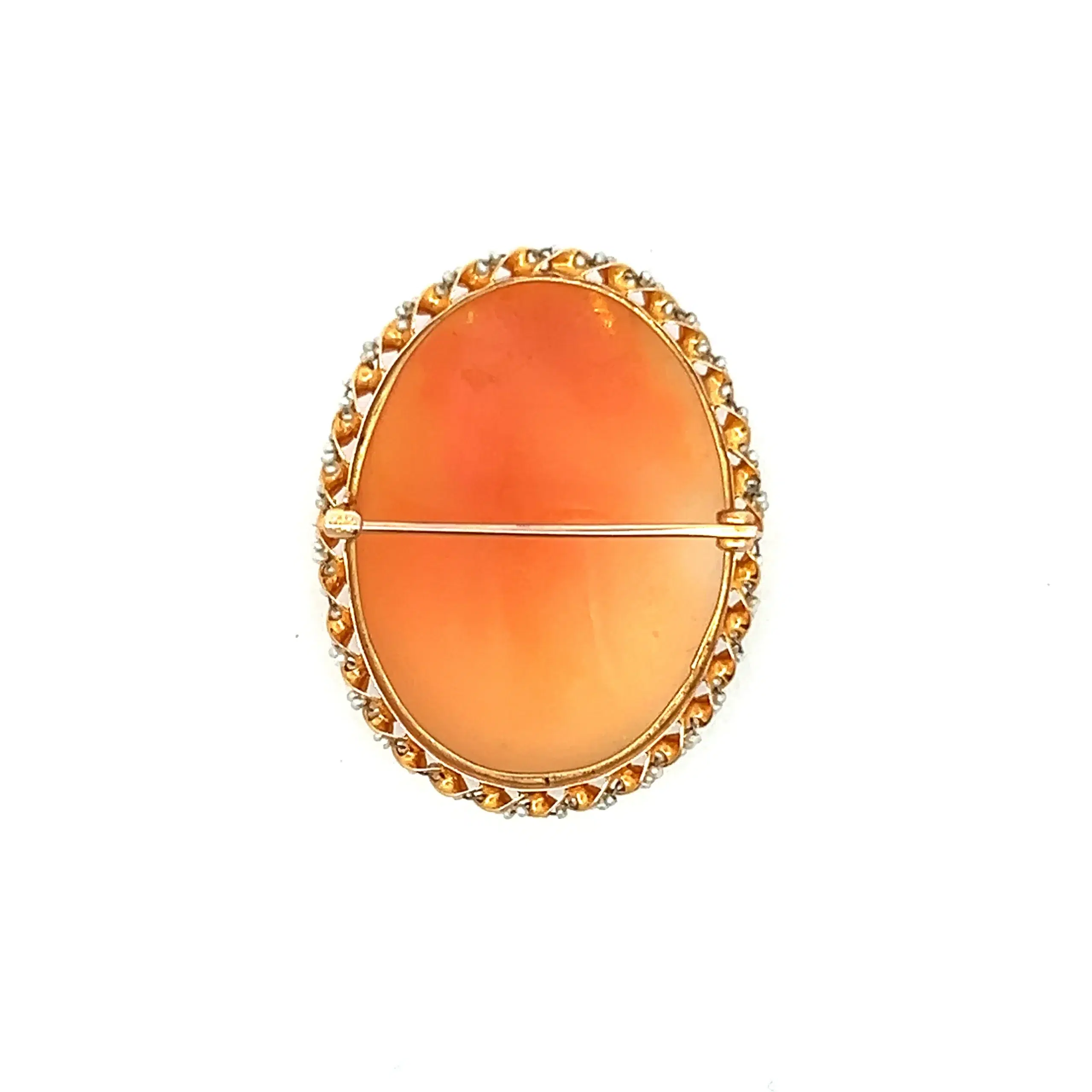 One estate antique 10 karat yellow gold cameo brooch with a seed pearl halo.