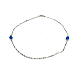 One estate sterling silver anklet with 2 round cabochon lapis lazuli beads measuring 4mm each on a 9.5" anklet. spring ring clasp.