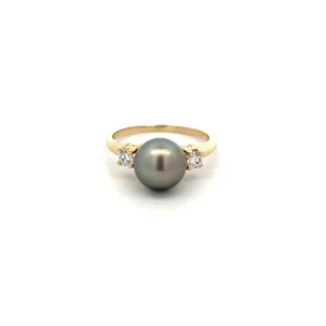 One estate 14 karat yellow gold gray pearl and diamond ring with a center 8.5mm round gray pearl flanked by 2 round brilliant-cut diamonds weighing 0.20 carat total weight with I color and Si2 clarity.