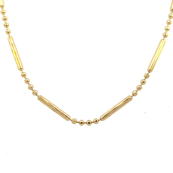 One estate 18 karat yellow gold hollow tube and beaded chain necklace measuring 24" long with a spring ring clasp.
