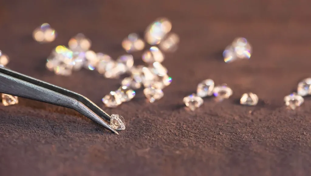 A collection of loose diamonds. Sell your diamonds with Nelson Coleman Jewelers.