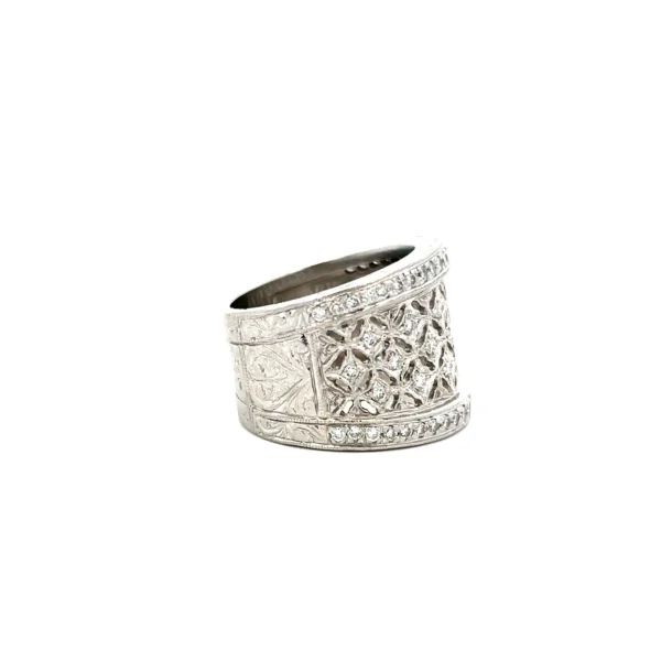 Estate platinum wide diamond lace band with 65 round brilliant-cut diamonds in an openwork lace design.