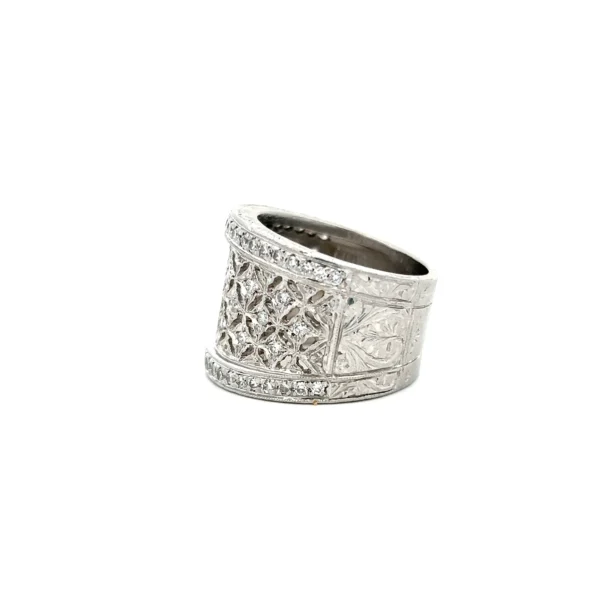 Estate platinum wide diamond lace band with 65 round brilliant-cut diamonds in an openwork lace design.