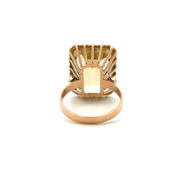 Estate Vintage Citrine Ring in 18K yellow gold featuring a 13.08 carat emerald-cut citrine with a textured triangular pattern frame.