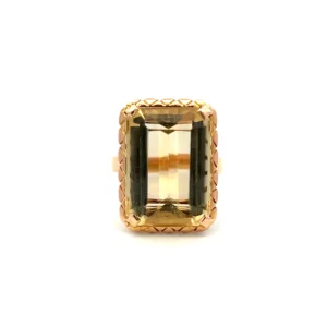 Estate Vintage Citrine Ring in 18K yellow gold featuring a 13.08 carat emerald-cut citrine with a textured triangular pattern frame.